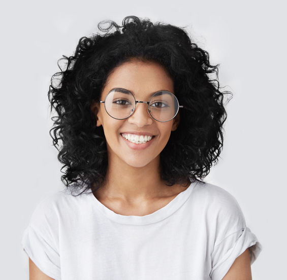 Smiling woman wearing glasses and a white top