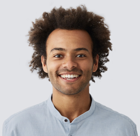 Man smiling in a light blue shirt